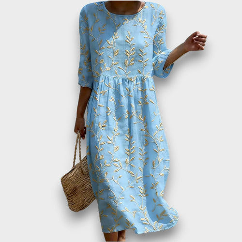 Sira | Vestido midi con escote redondo y estampado de plantas y flores